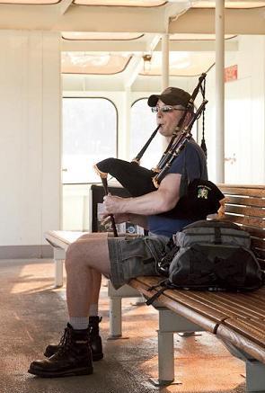 BagpiperDon playing smallpipes on a Washington State Ferry